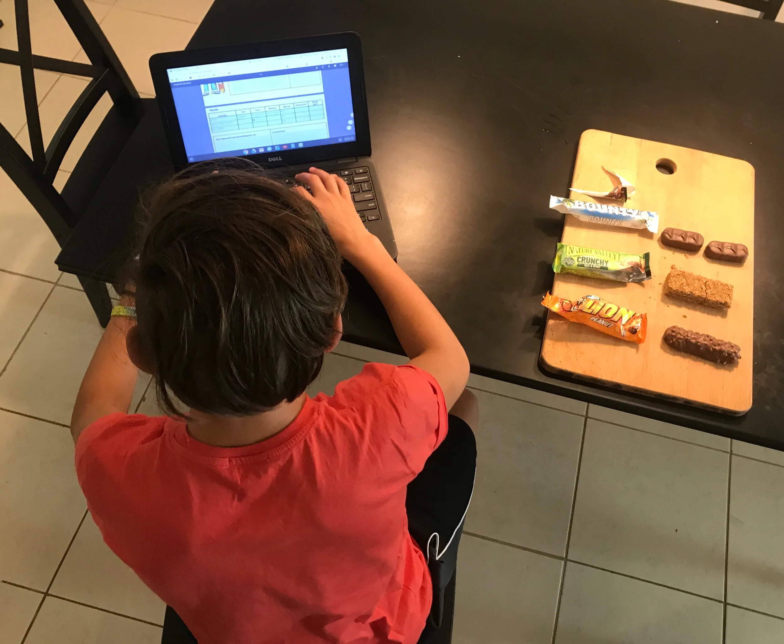 Kaio doing a science experiment on density (from Boulder Universal)