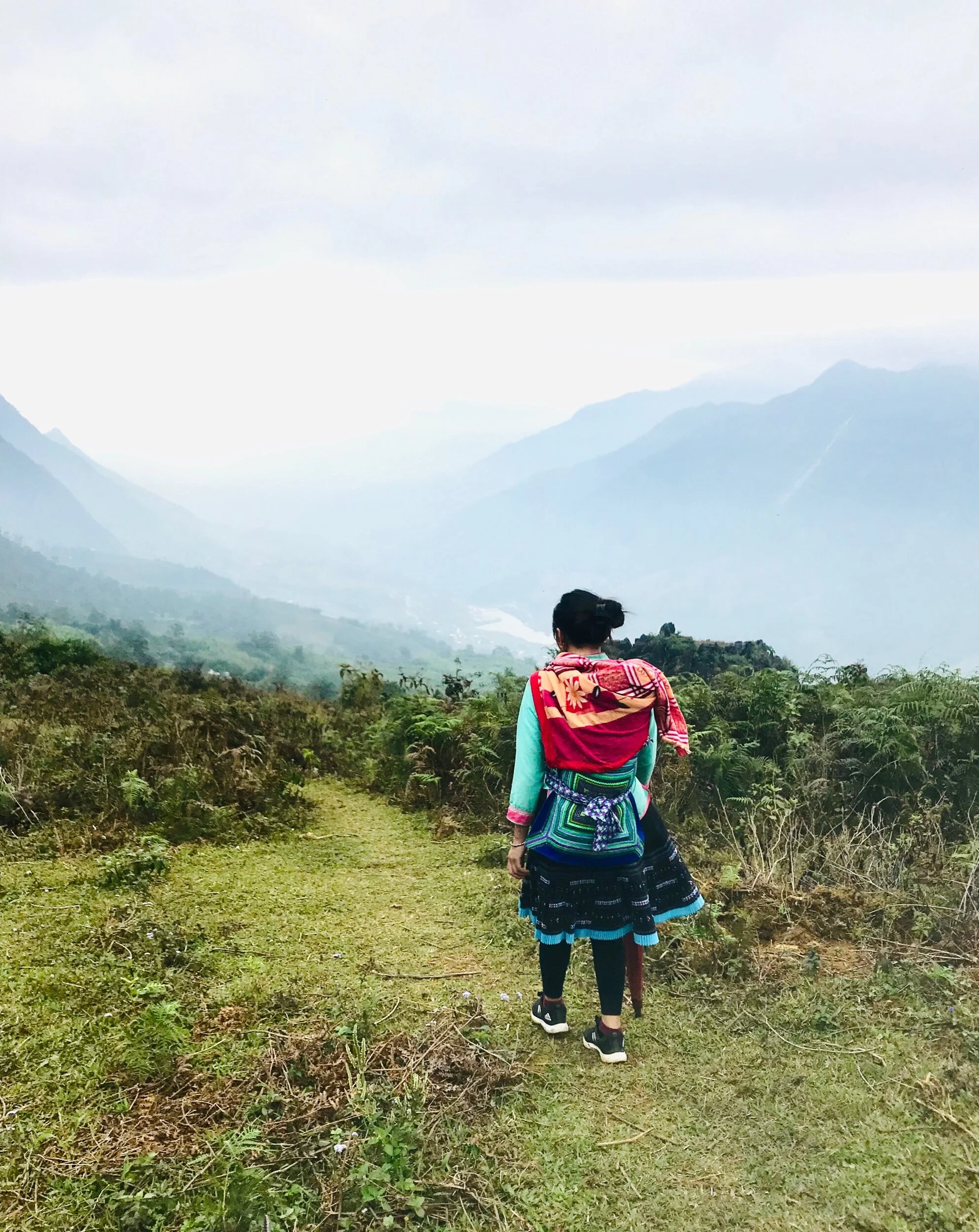 Sapa and our trekking guide, La and her baby (wrapped in the bundle on her back)