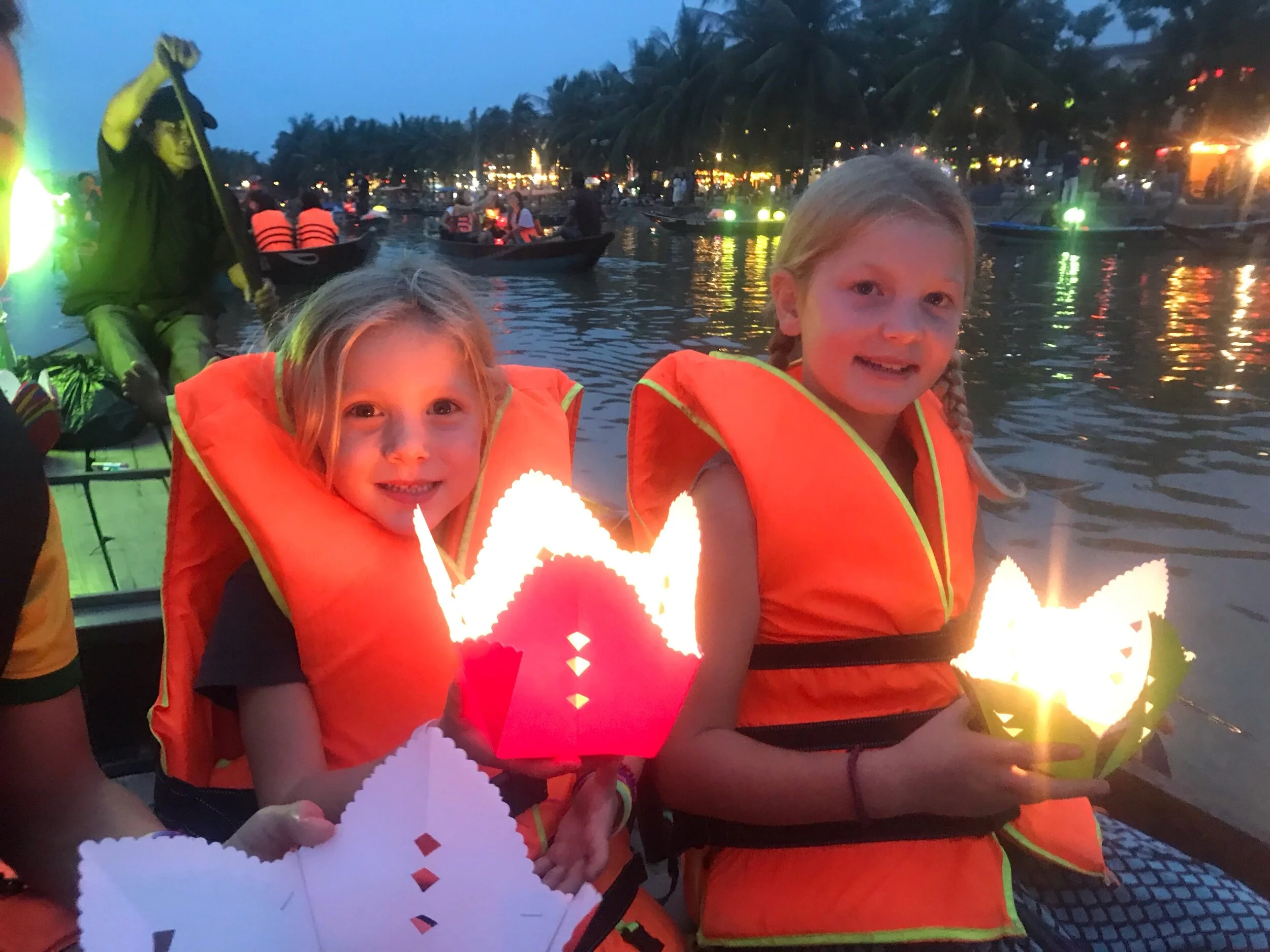 The girls releasing lanterns on the river